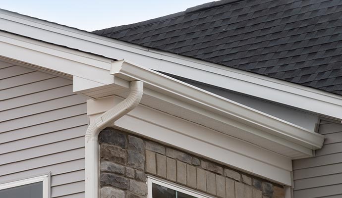 Installed house roof gutter downspout Installed house roof gutter downspout